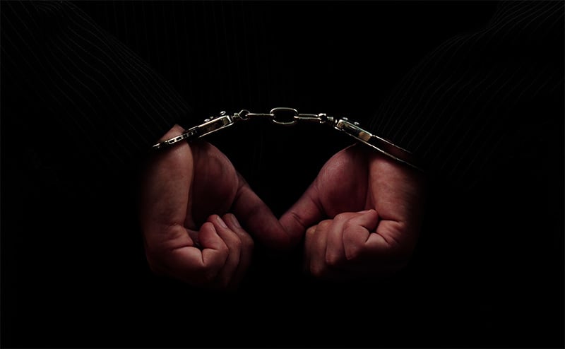 Image of hands in handcuffs